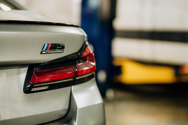 M5 Competition badge on the trunk lid of a silver BMW