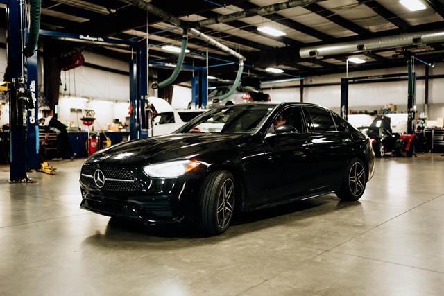 Black Mercedes-Benz sedan in the Turning Wrenches service bay