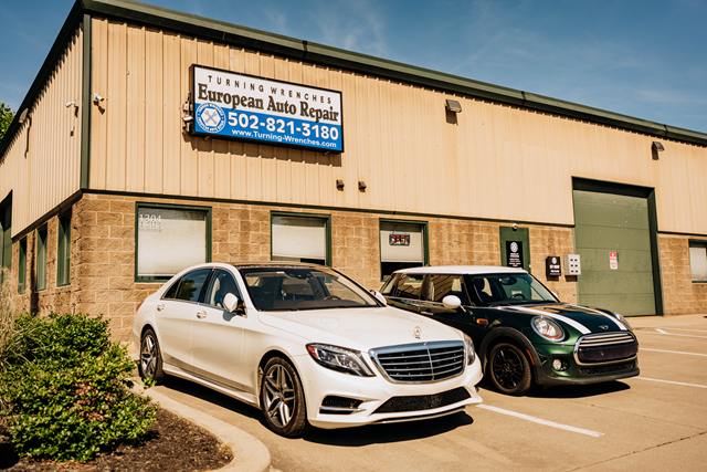 Turning Wrenches European Auto Repair shop at 1304 N English Station Rd in Louisville, with a white Mercedes-Benz S-Class and a green MINI Cooper out front
